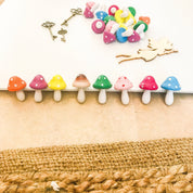 Large wooden mushrooms, ideal for fairy gardens, whimsical decor, or Christmas elf setups.