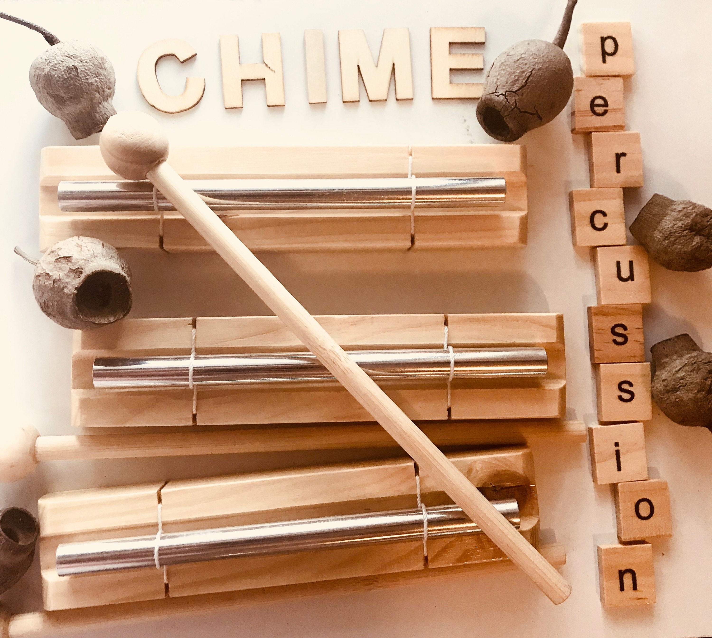 Percussion chime and drumstick, a fun musical instrument for all ages.