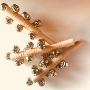Jasmine bell rattle, a soft-sounding handmade rattle perfect for sensory play.