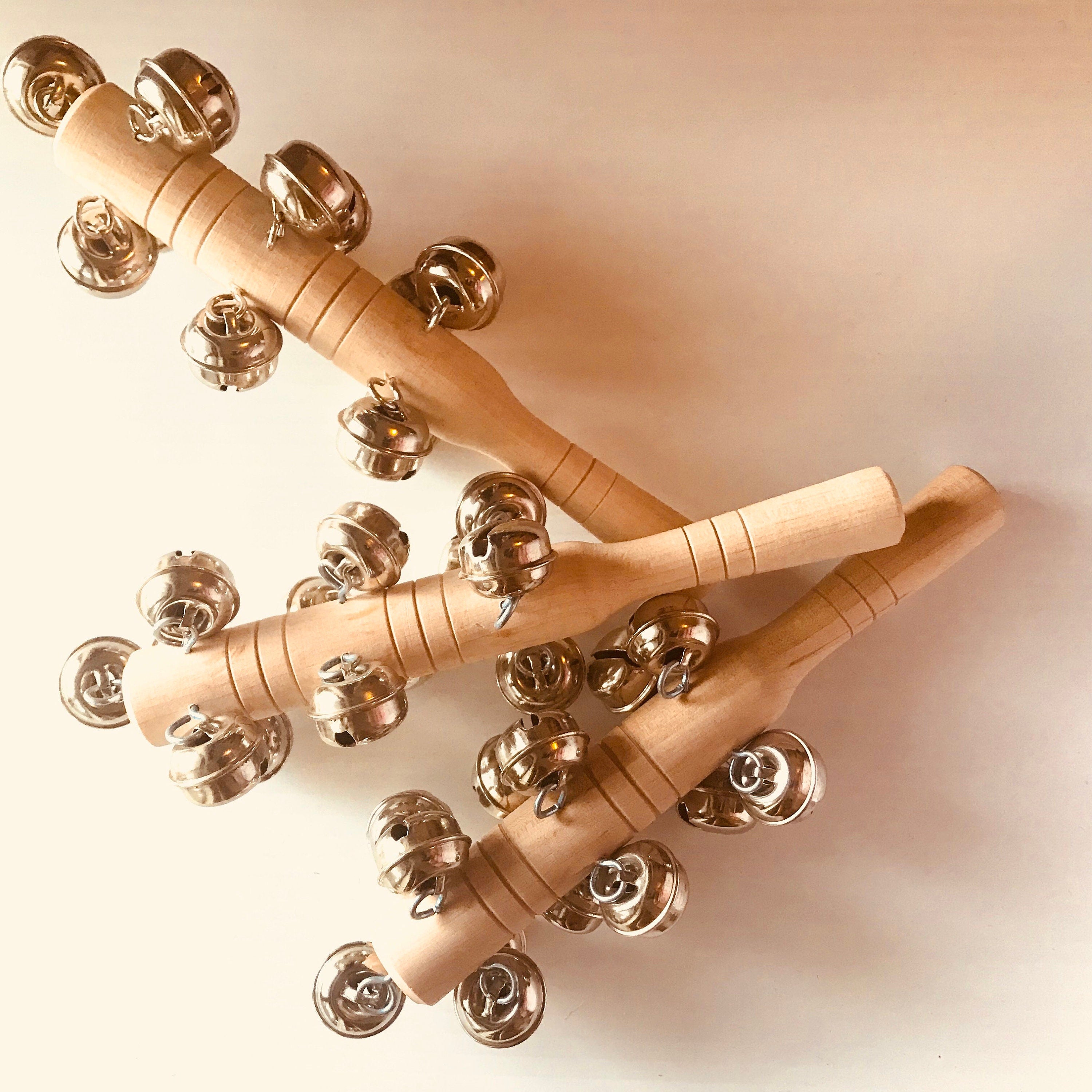 Jasmine bell rattle, a soft-sounding handmade rattle perfect for sensory play.