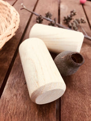 Natural cylindrical shaker, a single piece for rhythmic play or musical exploration.