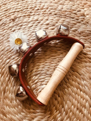 Half-moon tambourine, a delightful kids' musical instrument for rhythm fun and creativity.