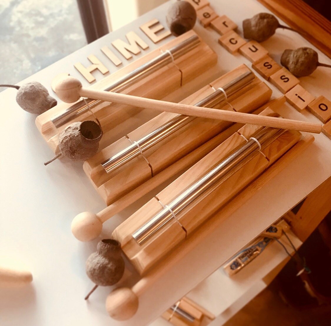 Percussion chime and drumstick, a fun musical instrument for all ages.