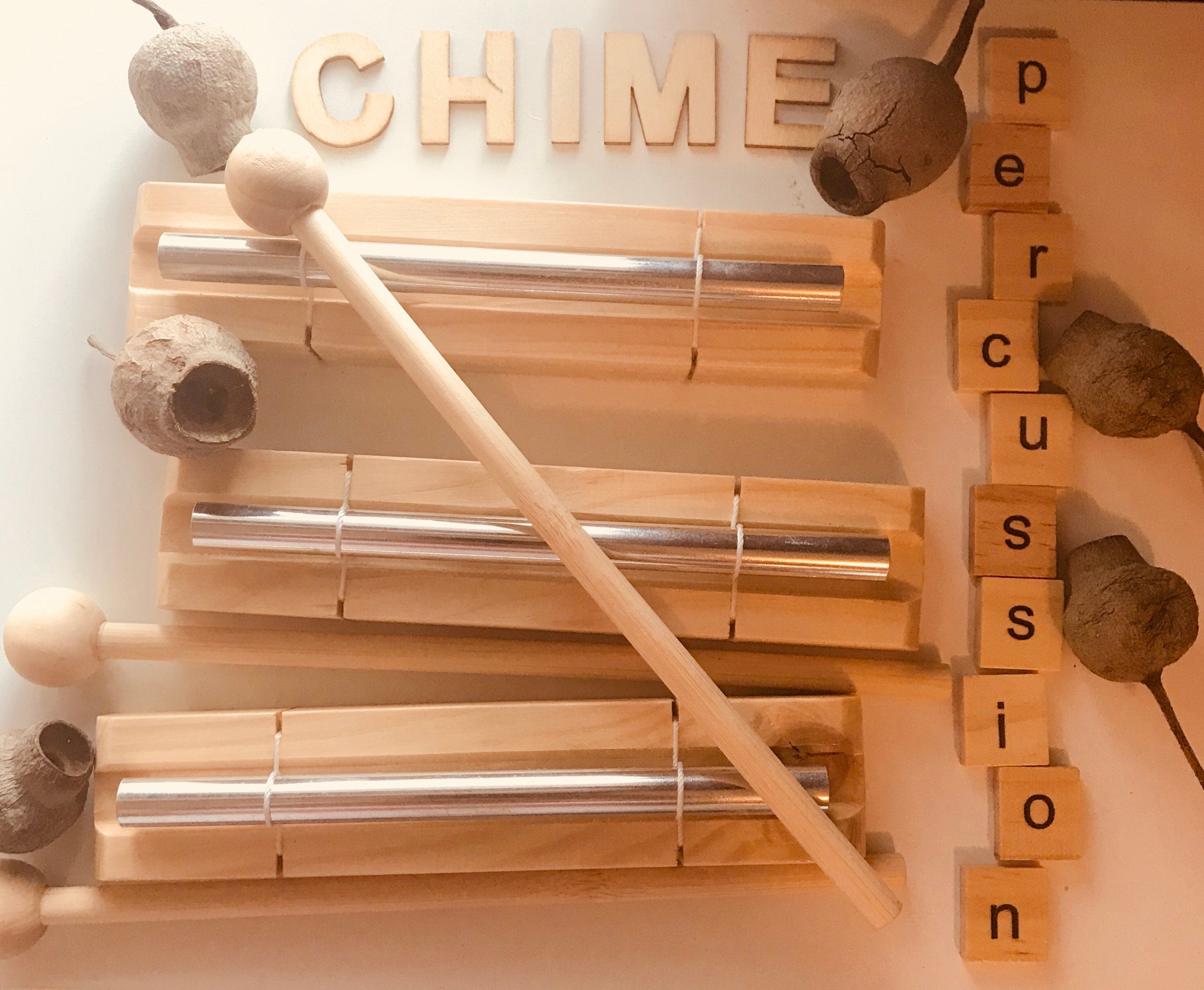 Percussion chime and drumstick, a fun musical instrument for all ages.