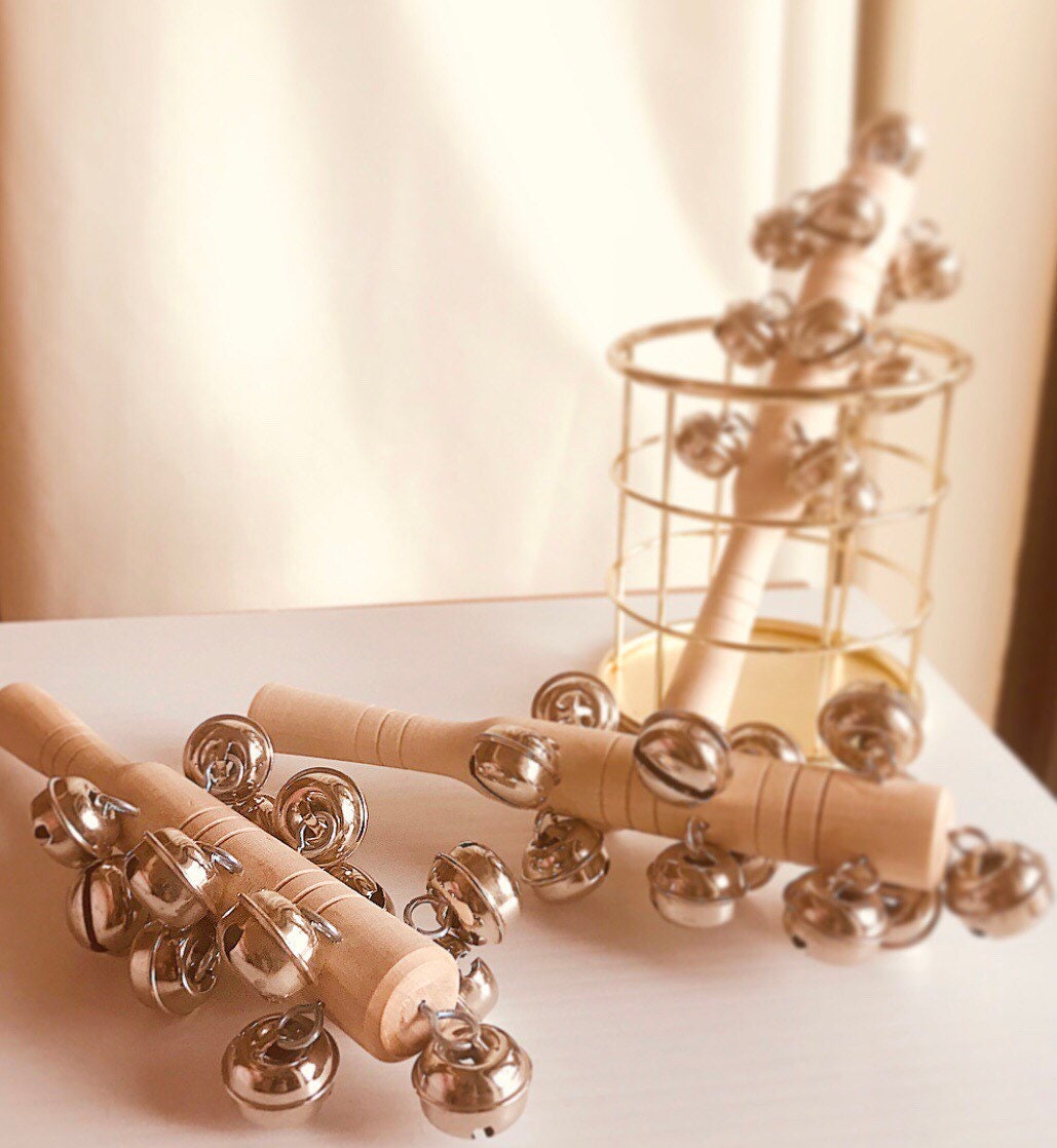 Jasmine bell rattle, a soft-sounding handmade rattle perfect for sensory play.