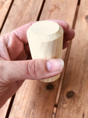 Natural cylindrical shaker, a single piece for rhythmic play or musical exploration.
