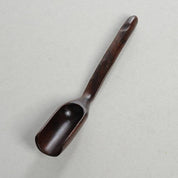 Long-handled wooden scoop, a versatile spoon perfect for natural play or kitchen use.