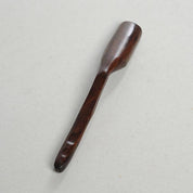 Long-handled wooden scoop, a versatile spoon perfect for natural play or kitchen use.
