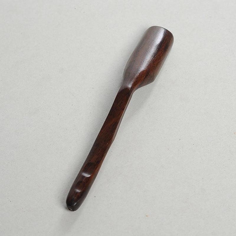 Long-handled wooden scoop, a versatile spoon perfect for natural play or kitchen use.