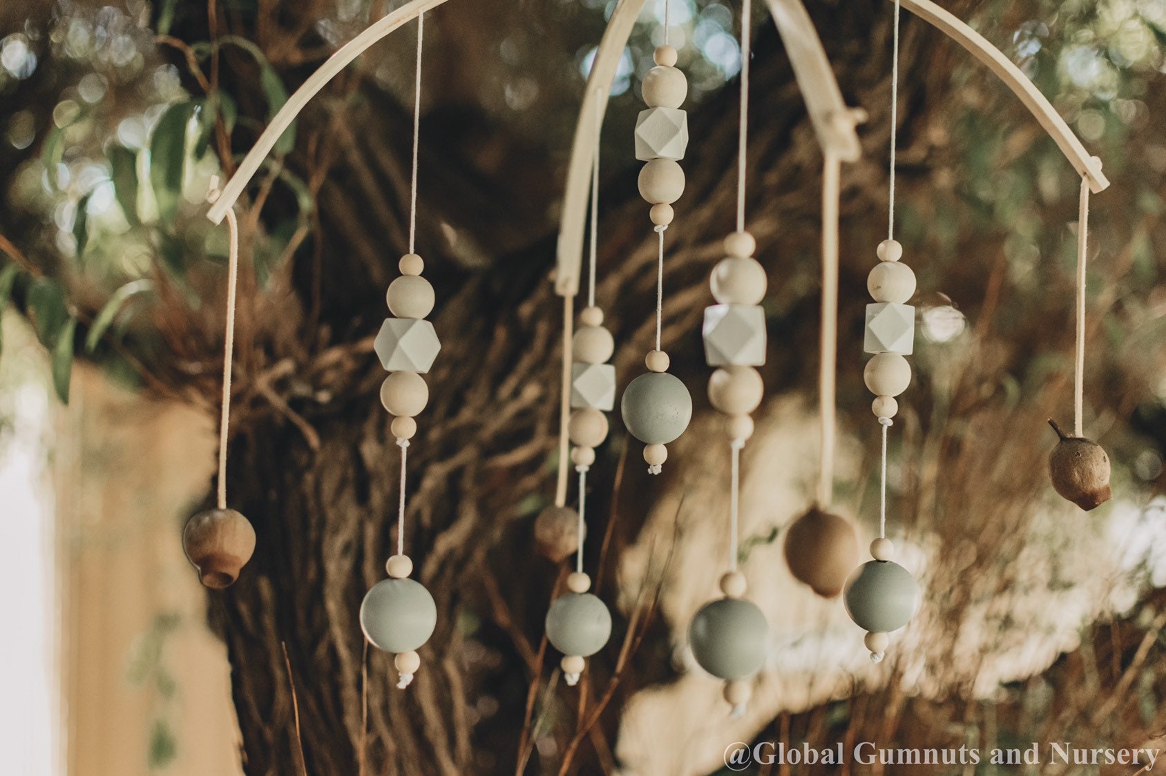 Australian Gumnut Arched Mobile: Delicate gumnut mobile for nursery decor.