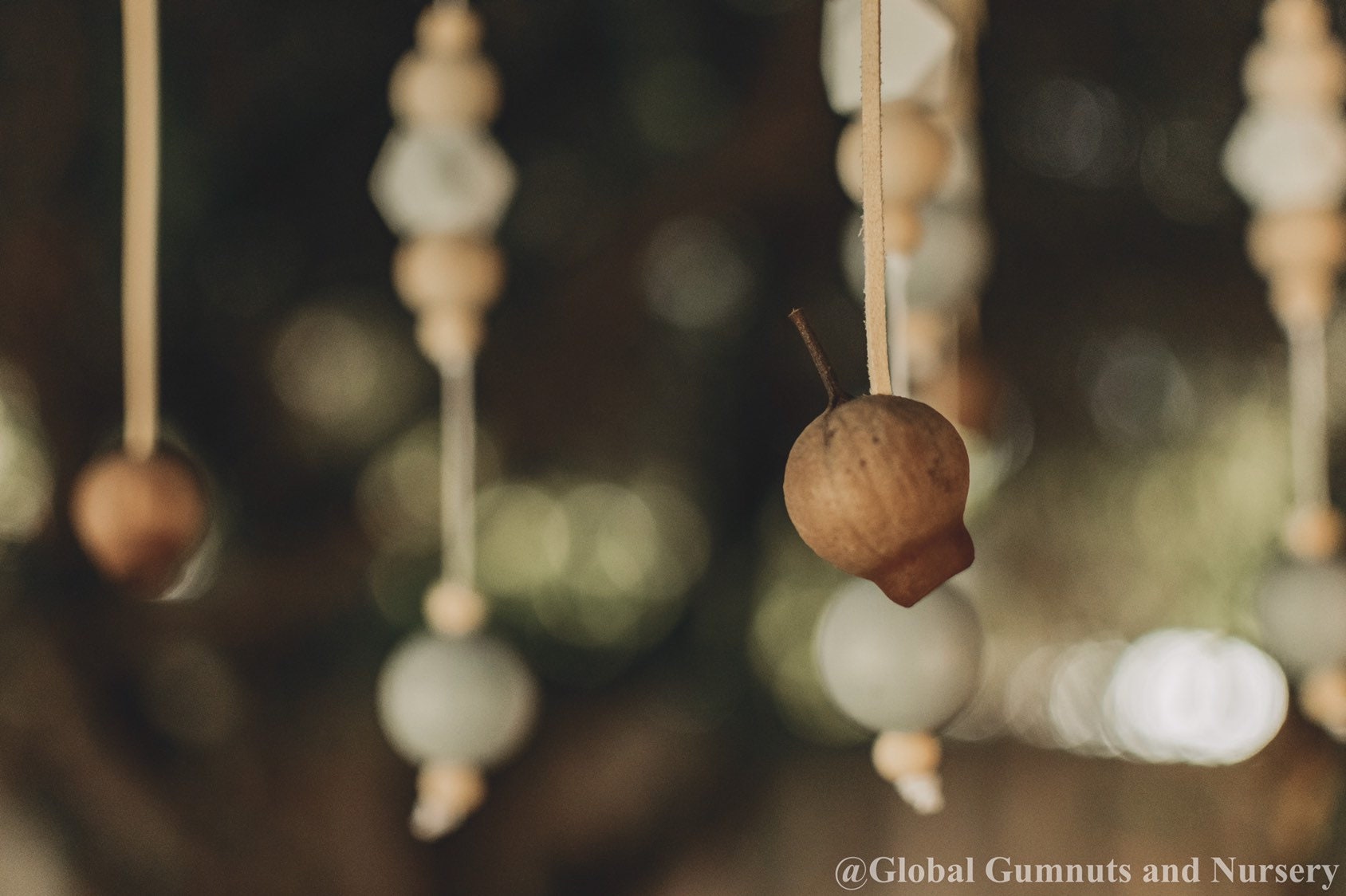 Australian Gumnut Arched Mobile: Delicate gumnut mobile for nursery decor.