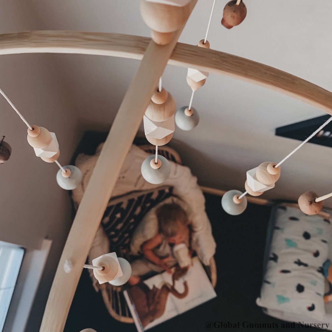 Australian Gumnut Arched Mobile: Delicate gumnut mobile for nursery decor.