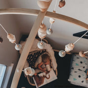 Australian Gumnut Arched Mobile: Delicate gumnut mobile for nursery decor.