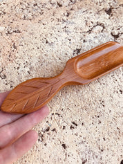 Natural Leaf Flat Scooper: Flat wooden scoop for sensory exploration.