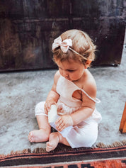 Natural cylindrical shaker, a single piece for rhythmic play or musical exploration.