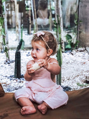 Natural cylindrical shaker, a single piece for rhythmic play or musical exploration.