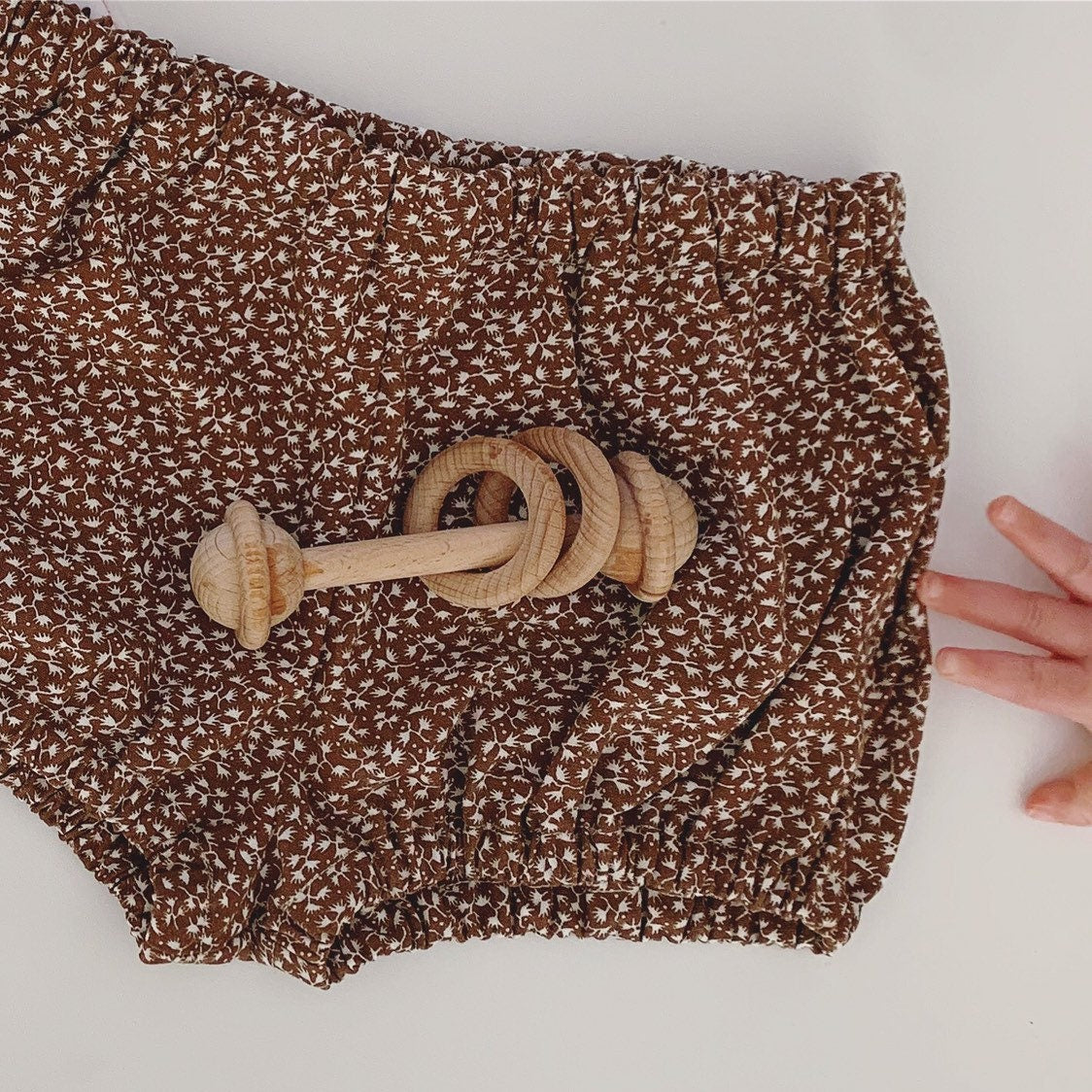 Natural baby rattle, a beautifully crafted, eco-friendly toy for little ones.