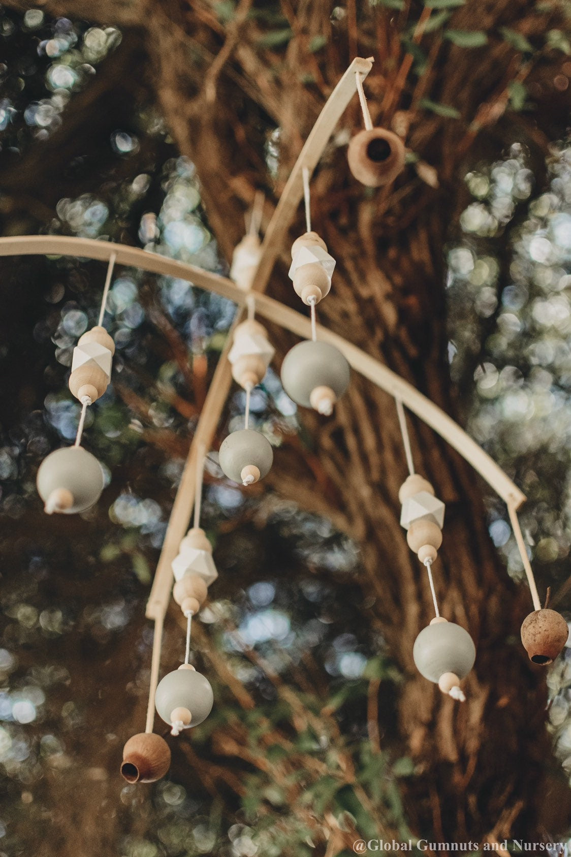 Australian Gumnut Arched Mobile: Delicate gumnut mobile for nursery decor.