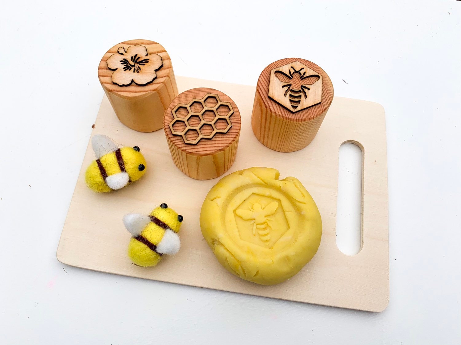 Adorable felt bees, perfect for kids' playtime, imaginative crafts, or buzzing into charming decor projects.