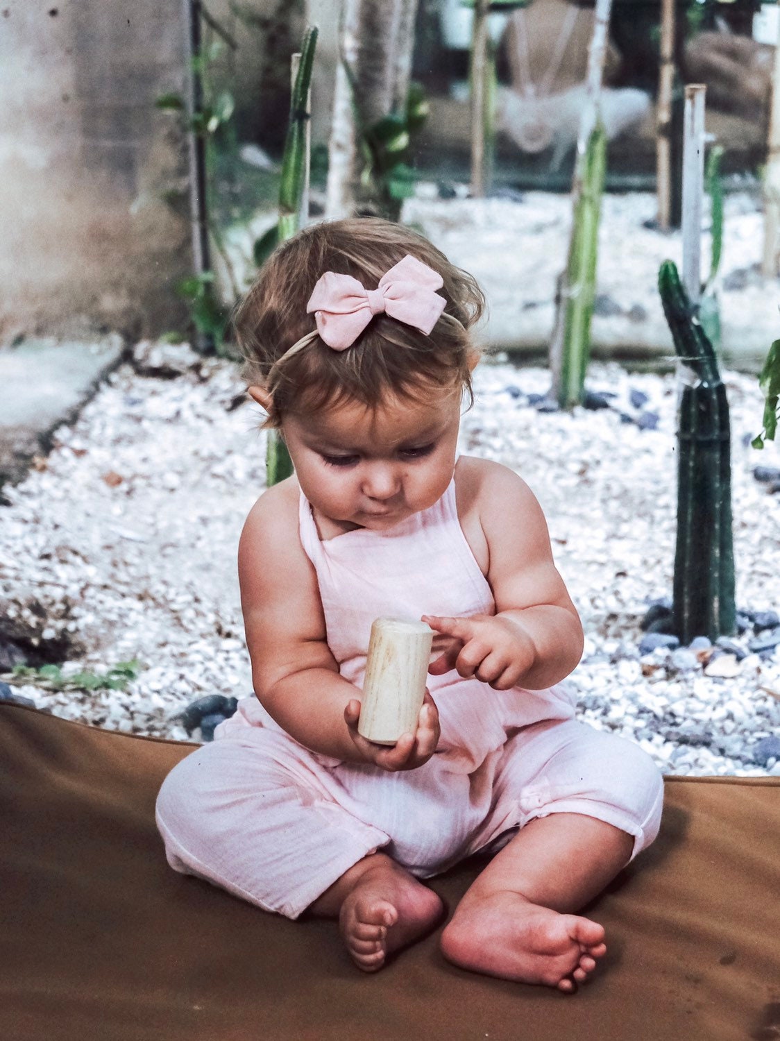 Natural cylindrical shaker, a single piece for rhythmic play or musical exploration.