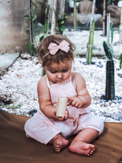 Natural cylindrical shaker, a single piece for rhythmic play or musical exploration.