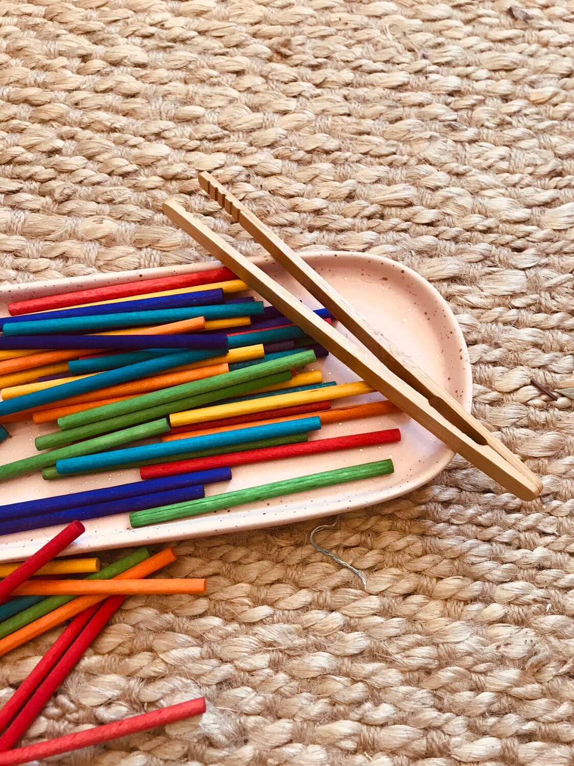 wooden baby tongs: early learning tongs for developing fine motor skills.