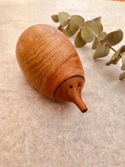Handmade Wooden Echidna: Natural wooden echidna figure for decoration or play.
