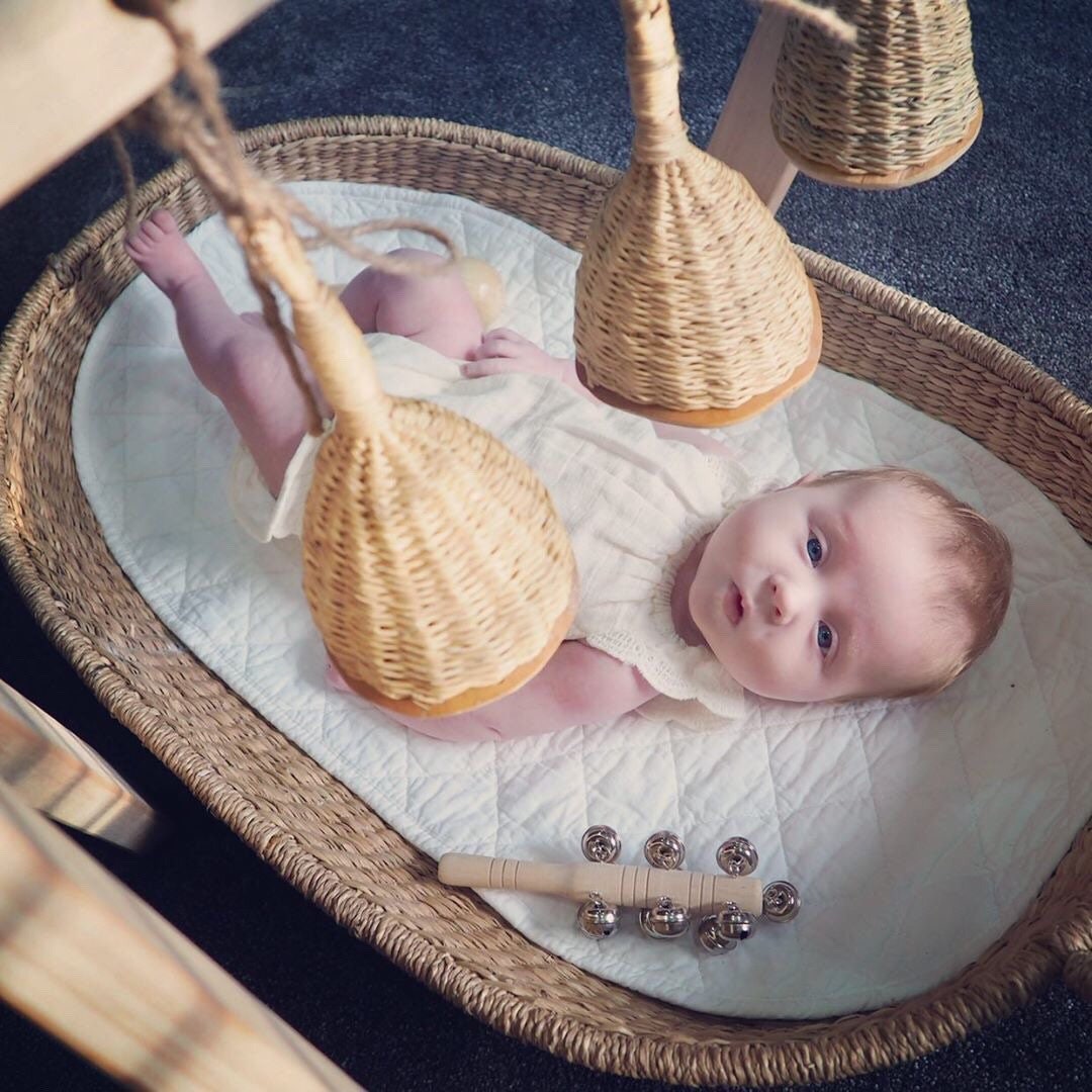 Jasmine bell rattle, a soft-sounding handmade rattle perfect for sensory play.