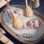 Jasmine bell rattle, a soft-sounding handmade rattle perfect for sensory play.