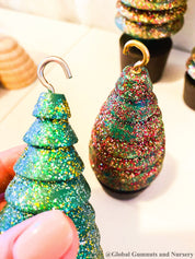 Glittery handmade wooden Christmas trees, creating a magical forest decor for the holiday season.