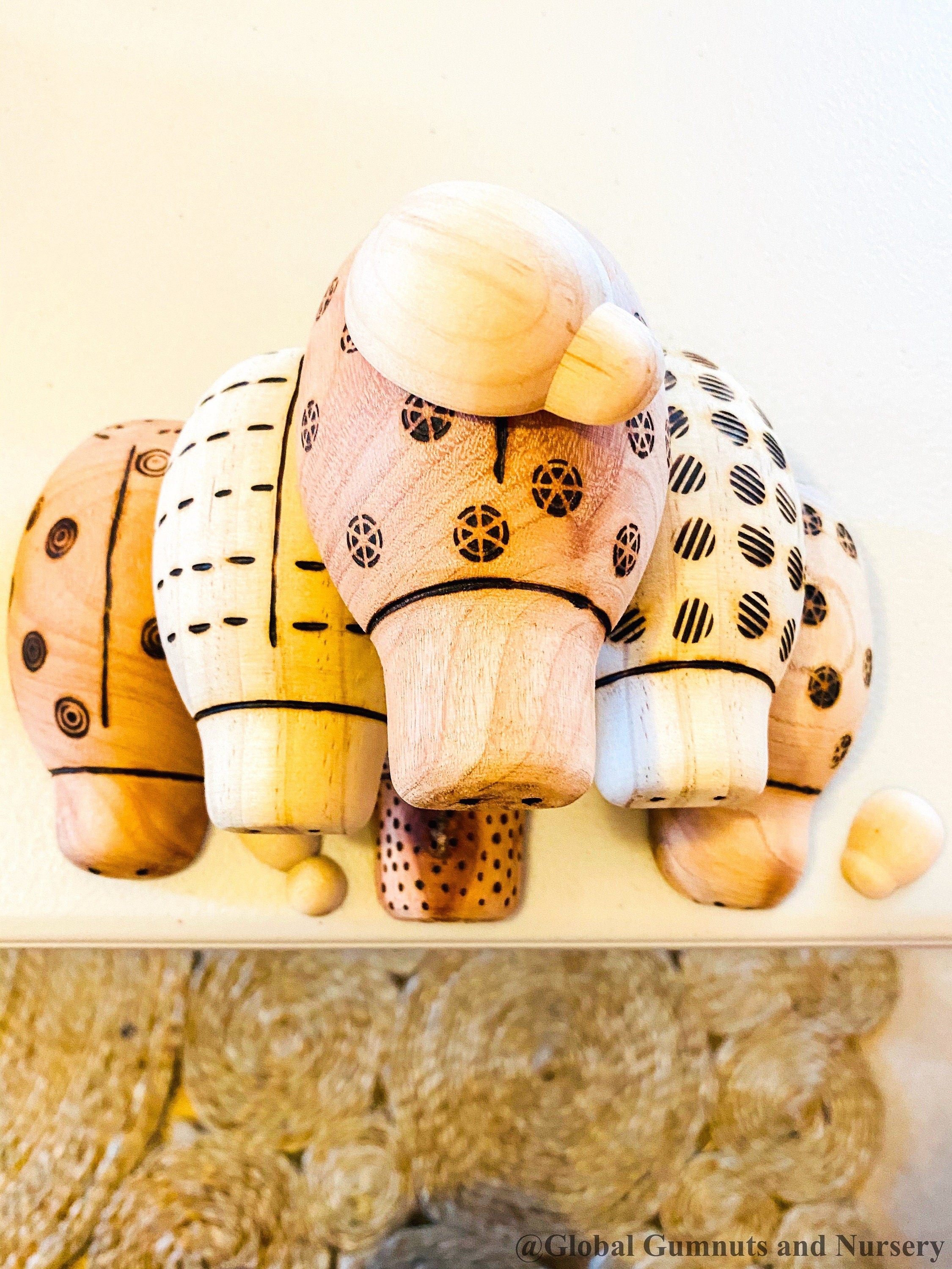 Handmade wooden ladybugs, perfect for decorating, learning, or bug-themed crafts.