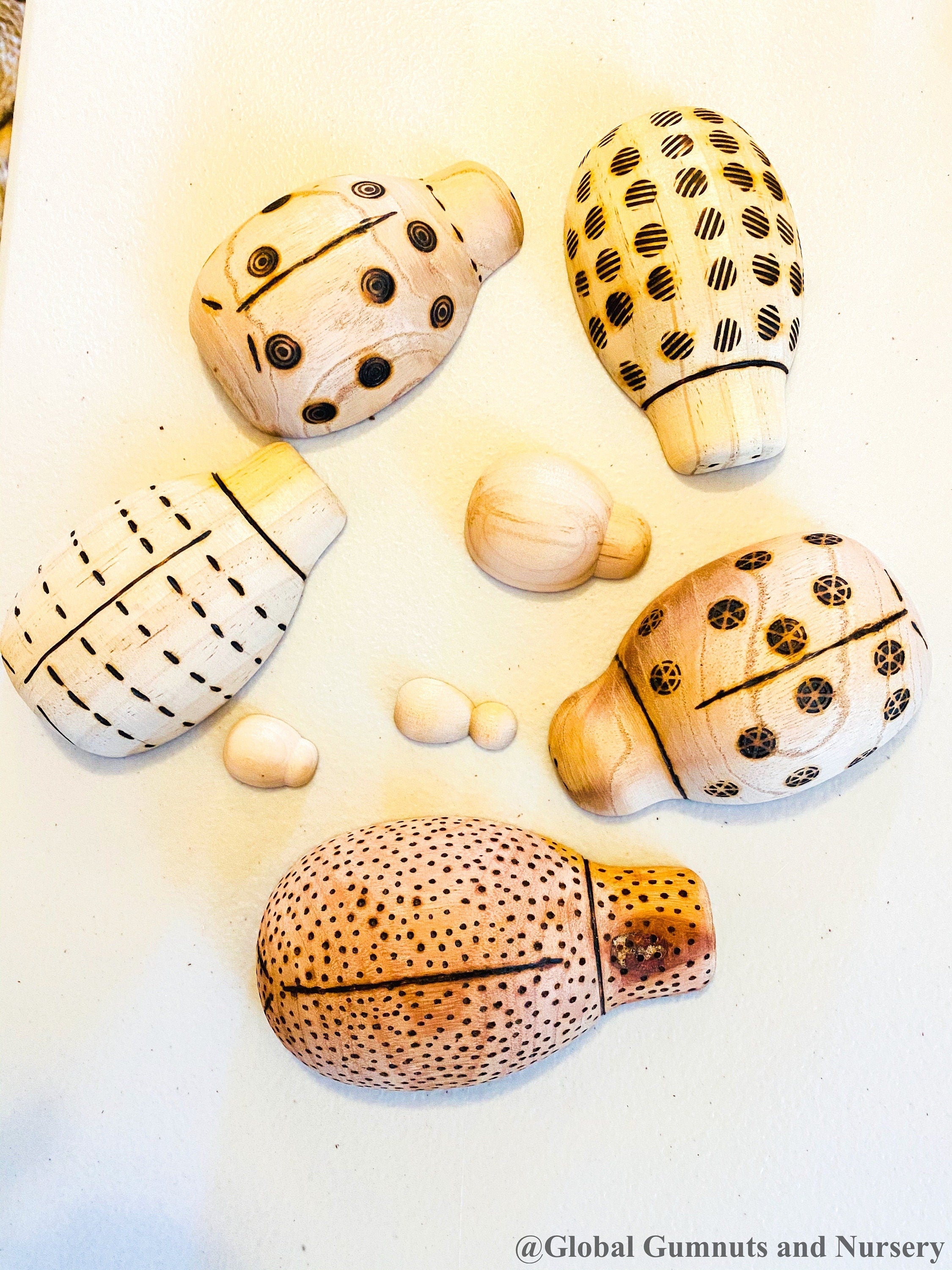 Handmade wooden ladybugs, perfect for decorating, learning, or bug-themed crafts.