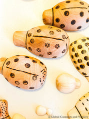 Handmade wooden ladybugs, perfect for decorating, learning, or bug-themed crafts.