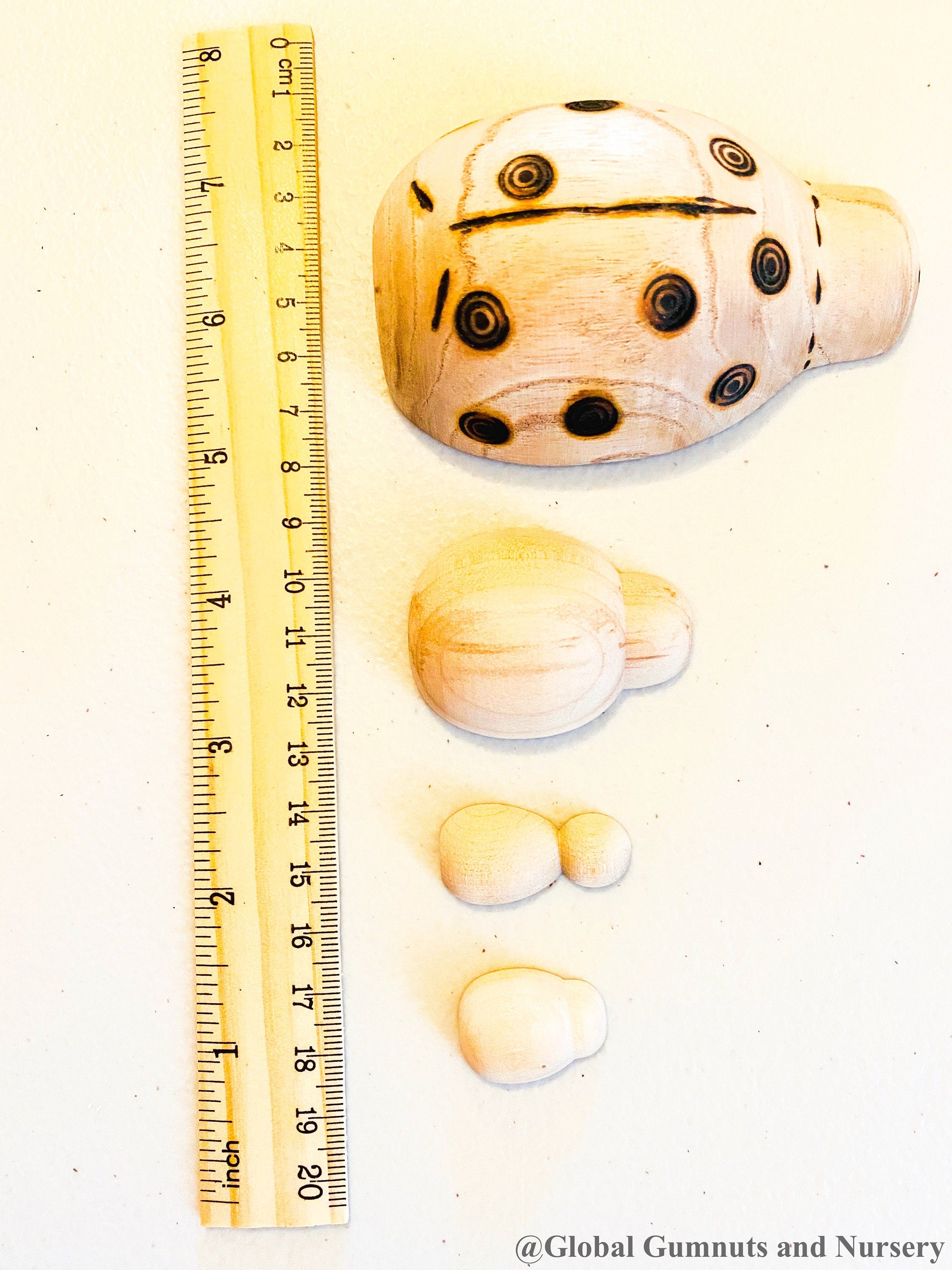 Handmade wooden ladybugs, perfect for decorating, learning, or bug-themed crafts.