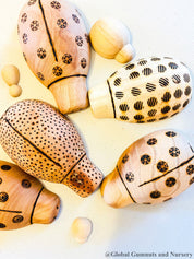 Handmade wooden ladybugs, perfect for decorating, learning, or bug-themed crafts.