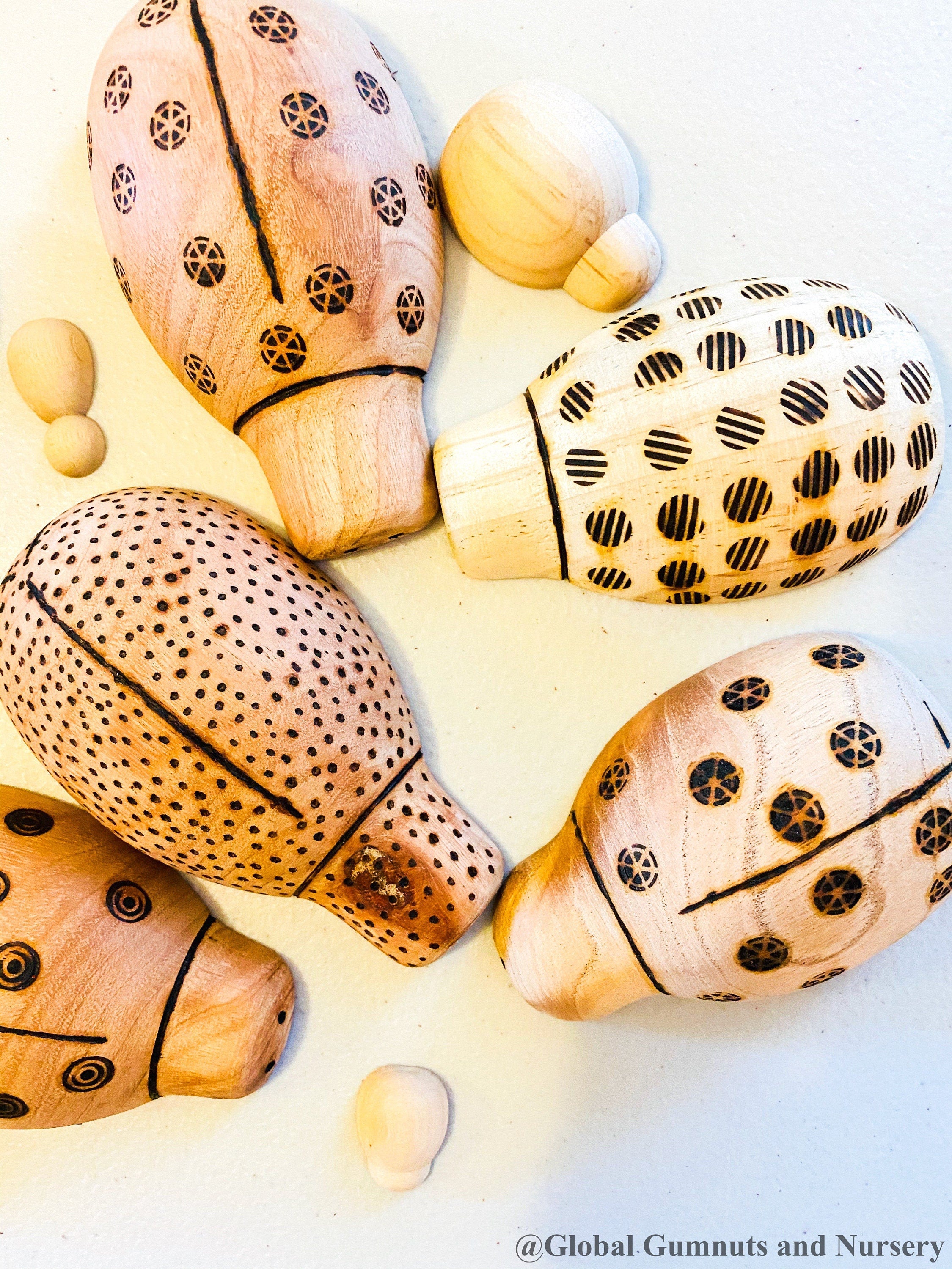 Handmade wooden ladybugs, perfect for decorating, learning, or bug-themed crafts.
