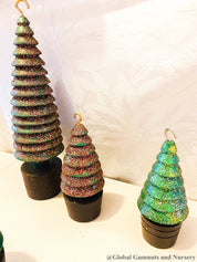 Glittery handmade wooden Christmas trees, creating a magical forest decor for the holiday season.