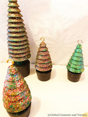 Glittery handmade wooden Christmas trees, creating a magical forest decor for the holiday season.