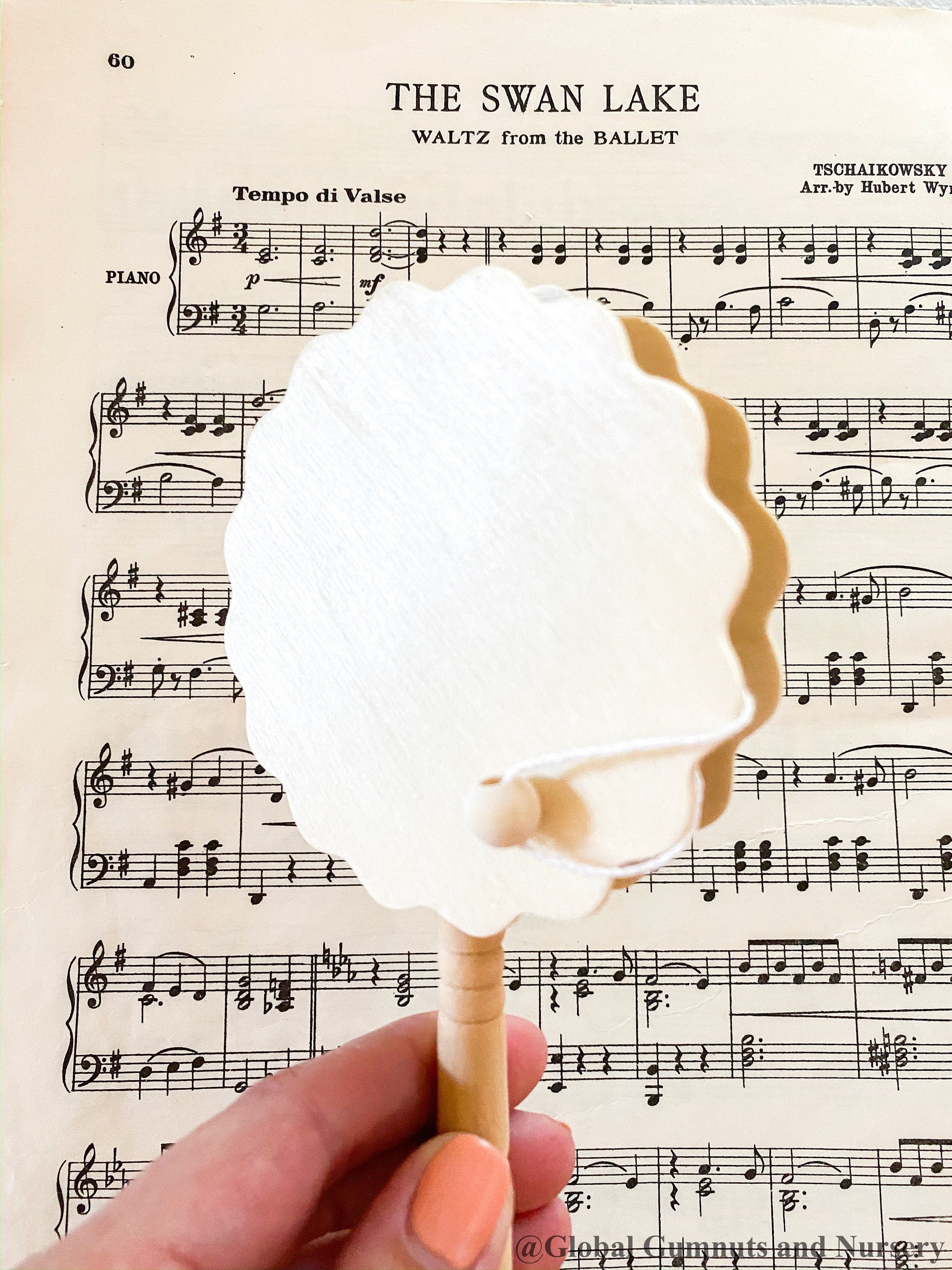 Natural wooden rattle drum, an engaging and eco-friendly musical toy for babies.