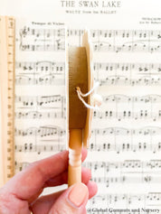 Natural wooden rattle drum, an engaging and eco-friendly musical toy for babies.