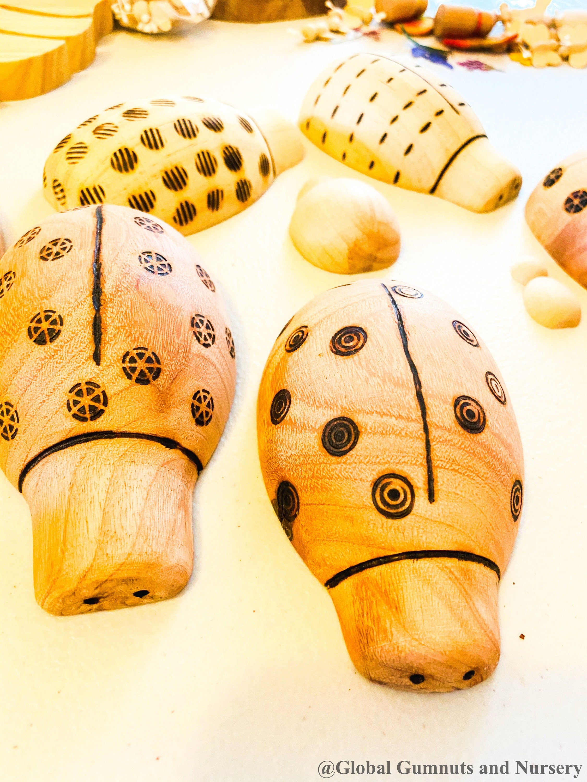 Handmade wooden ladybugs, perfect for decorating, learning, or bug-themed crafts.