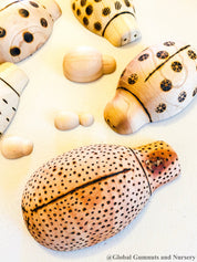 Handmade wooden ladybugs, perfect for decorating, learning, or bug-themed crafts.