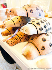 Handmade wooden ladybugs, perfect for decorating, learning, or bug-themed crafts.