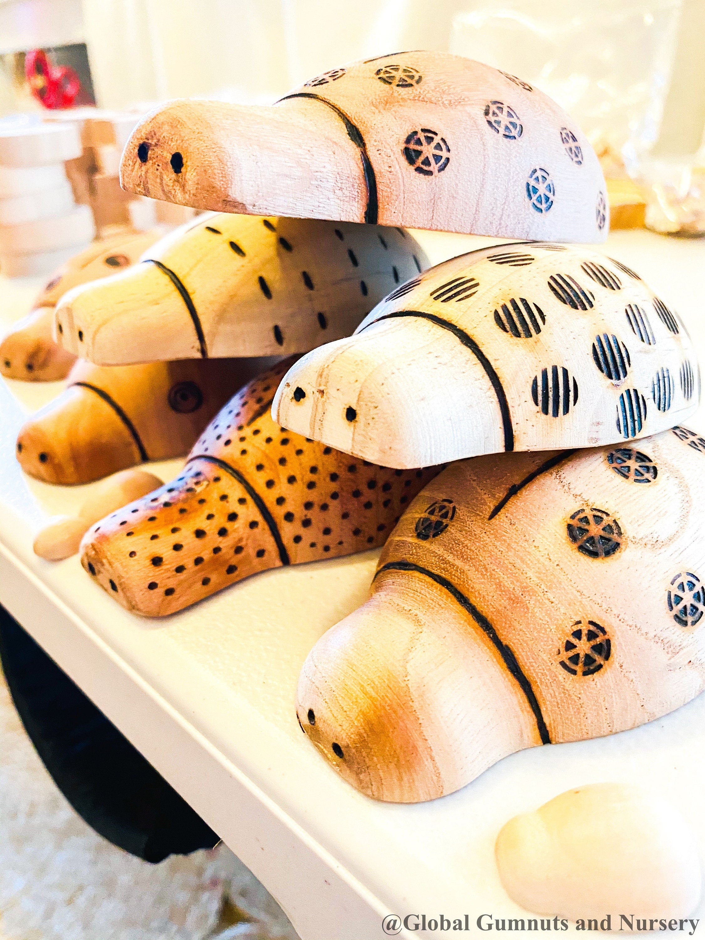 Handmade wooden ladybugs, perfect for decorating, learning, or bug-themed crafts.
