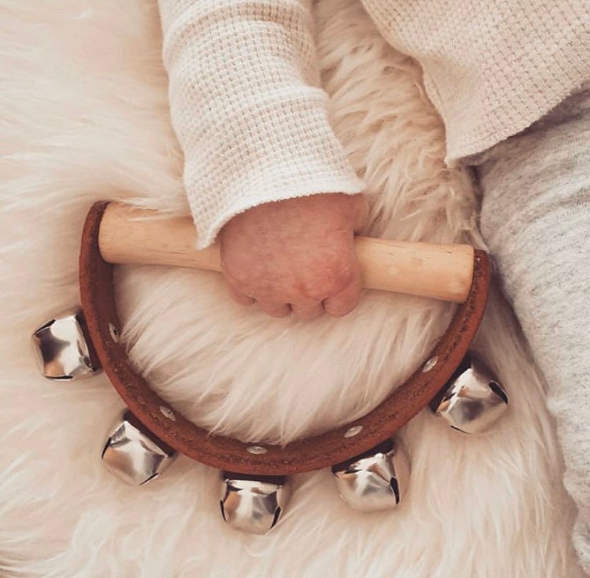 Half-moon tambourine, a delightful kids' musical instrument for rhythm fun and creativity.