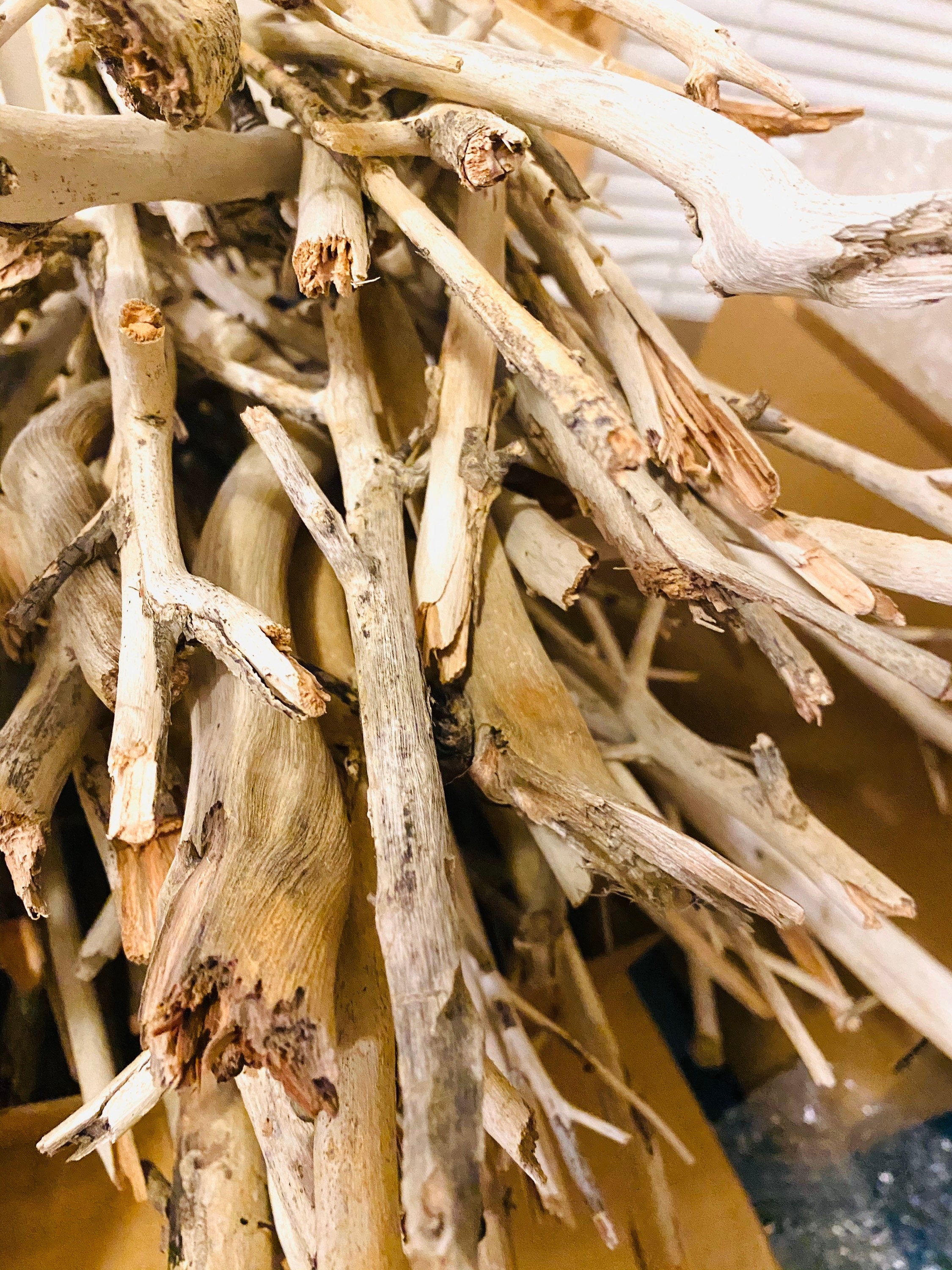 Natural driftwood pieces, versatile for crafts, decor, or beach-themed designs.