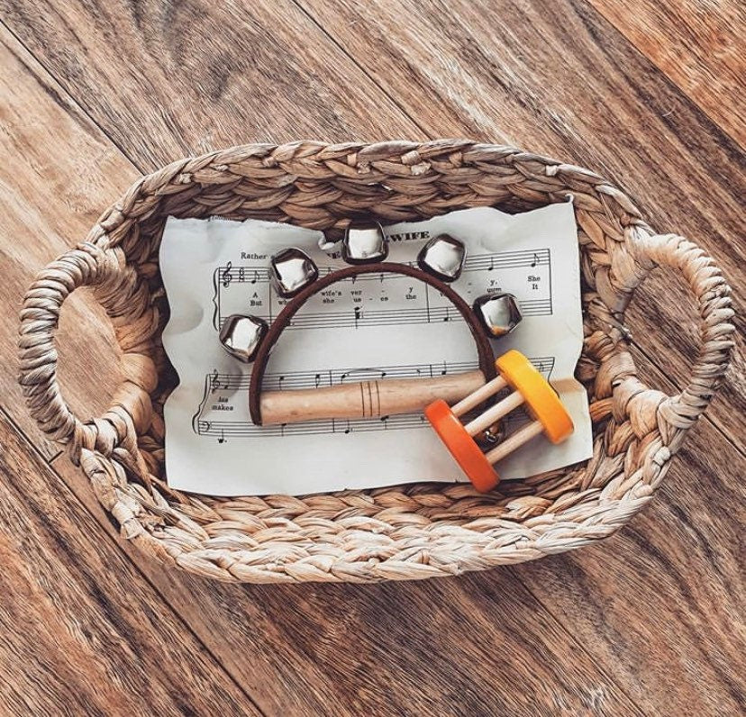 Half-moon tambourine, a delightful kids' musical instrument for rhythm fun and creativity.