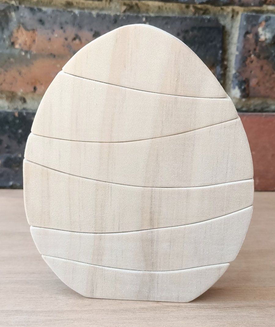 Rainbow Egg Wooden Stacker: Colourful egg-shaped stacker toy.