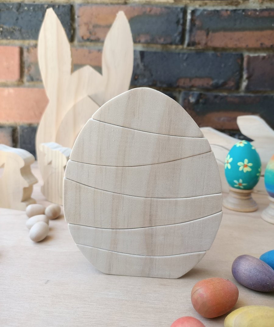 Rainbow Egg Wooden Stacker: Colourful egg-shaped stacker toy.