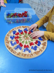 Wooden sorting board with 12 colorful sections for educational activities like counting, color sorting, and clock learning.